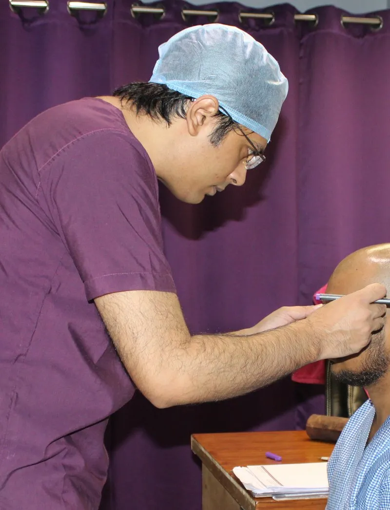 Dr. Vishal Purohit examining patient with empathetic care